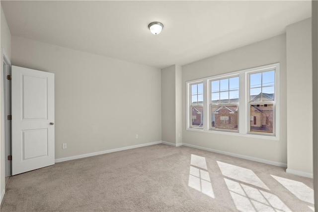 empty room featuring light carpet