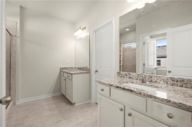 bathroom with tile patterned floors and vanity