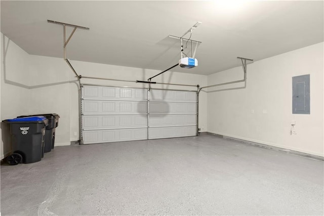 garage with a garage door opener and electric panel