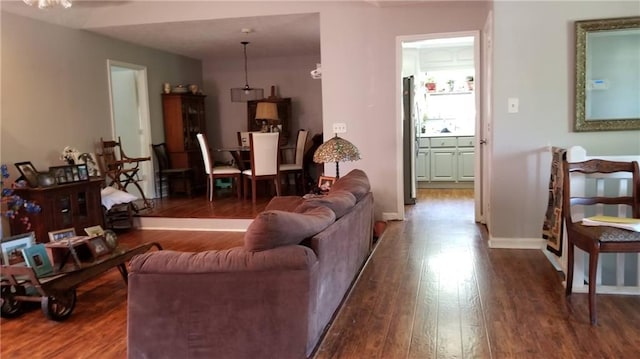 living room with dark hardwood / wood-style floors