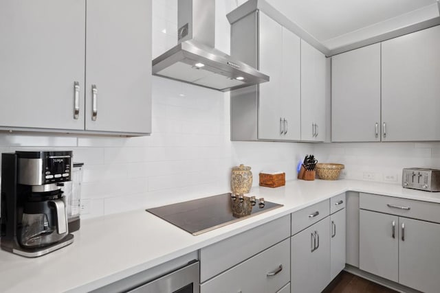 209 Floral Valley Dr, Woodstock, GA 30188 - kitchen featuring wall chimney exhaust hood, black electric stovetop, gray cabinetry, and tasteful backsplash