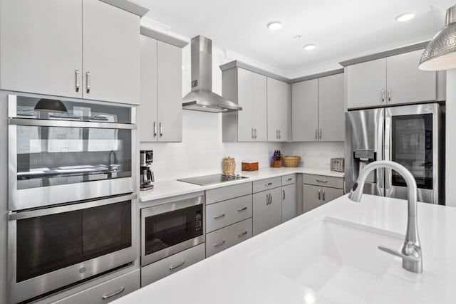 209 Floral Valley Dr, Woodstock, GA 30188 - kitchen with wall chimney exhaust hood, appliances with stainless steel finishes, gray cabinetry, light countertops, and a sink