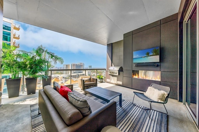 view of patio / terrace featuring a grill and an outdoor hangout area