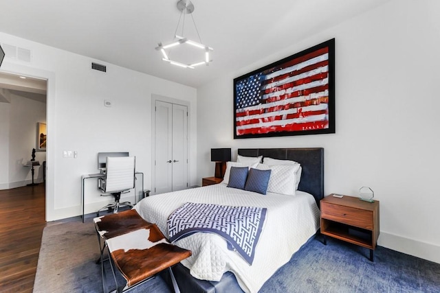 bedroom featuring dark hardwood / wood-style flooring