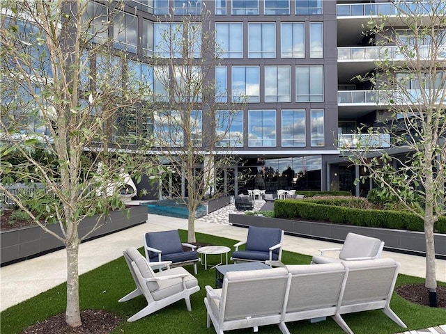 view of property's community featuring an outdoor hangout area