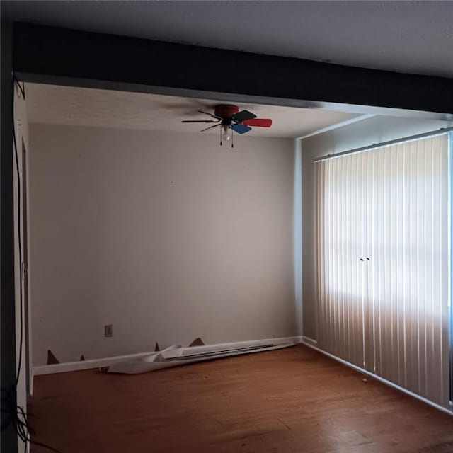 interior space featuring beamed ceiling and hardwood / wood-style flooring