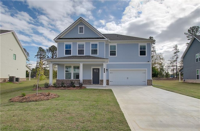 craftsman inspired home with a front yard, concrete driveway, cooling unit, and a garage