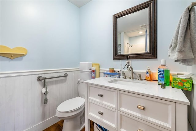 294 Hillcrest Hts, Cornelia, GA 30531 - bathroom with toilet, wainscoting, vanity, and wood finished floors