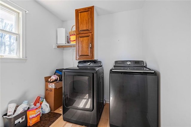 294 Hillcrest Hts, Cornelia, GA 30531 - laundry area featuring cabinet space, washing machine and dryer, and light wood-style flooring