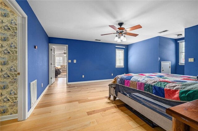 294 Hillcrest Hts, Cornelia, GA 30531 - bedroom with wood finished floors, baseboards, multiple windows, and ceiling fan
