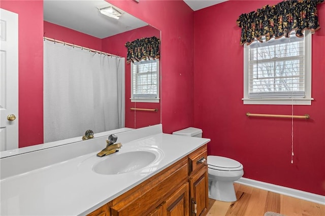 294 Hillcrest Hts, Cornelia, GA 30531 - full bath with vanity, toilet, wood finished floors, a shower with curtain, and baseboards