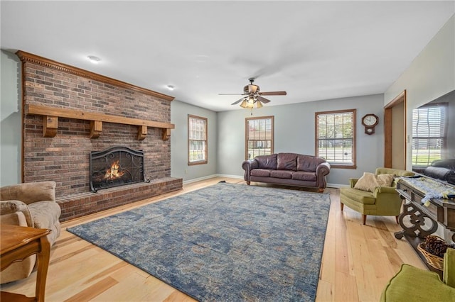 294 Hillcrest Hts, Cornelia, GA 30531 - living area featuring a brick fireplace, a ceiling fan, wood finished floors, and baseboards