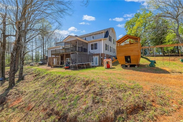 294 Hillcrest Hts, Cornelia, GA 30531 - back of property with a playground, a trampoline, and a yard