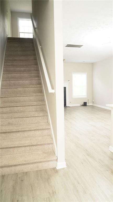 623 Shadowmoore Dr, Riverdale, GA 30274 - stairs with wood finished floors and baseboards