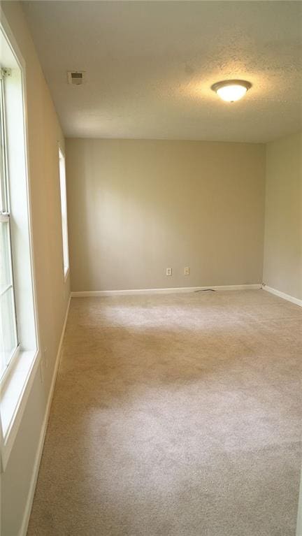 623 Shadowmoore Dr, Riverdale, GA 30274 - unfurnished room with light colored carpet and a textured ceiling