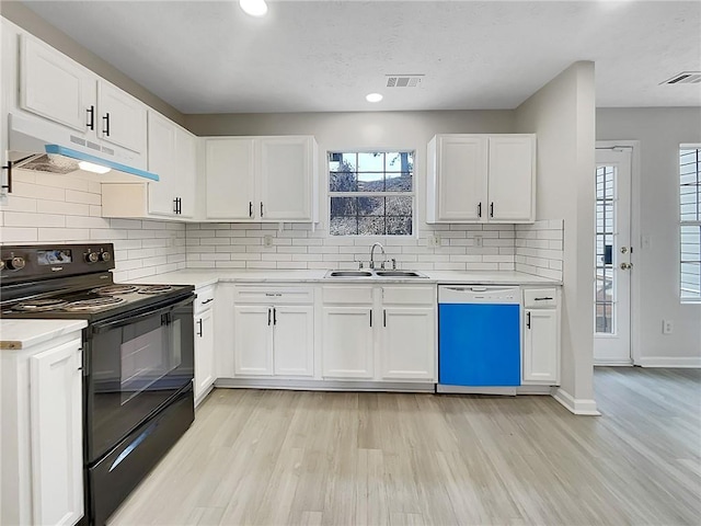 kitchen featuring black / electric stove, white cabinetry, dishwasher, and sink