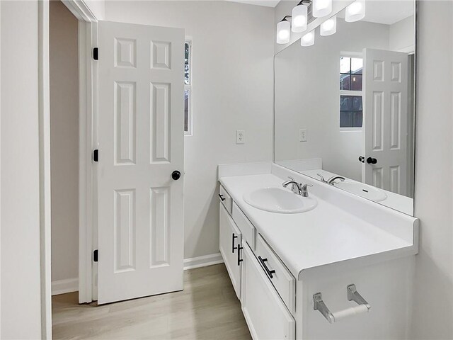 bathroom featuring vanity and hardwood / wood-style flooring