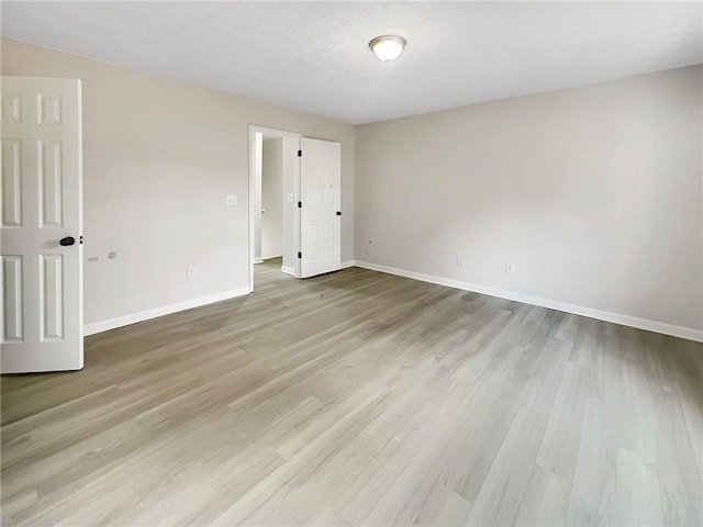 empty room with light hardwood / wood-style floors