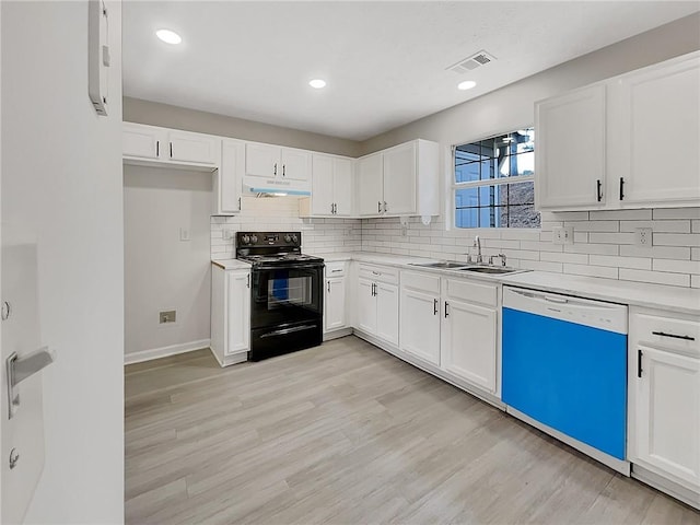 kitchen featuring black electric range, white dishwasher, white cabinetry, and sink