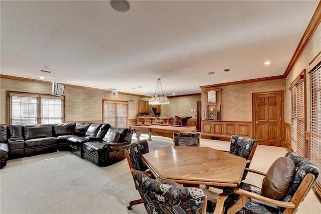 carpeted dining room featuring crown molding and billiards