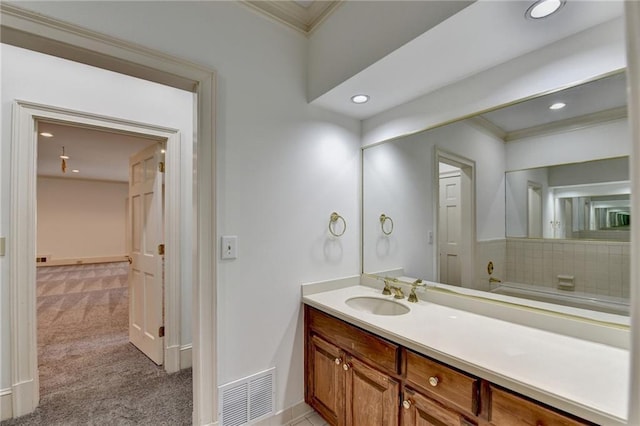 bathroom with vanity and ornamental molding