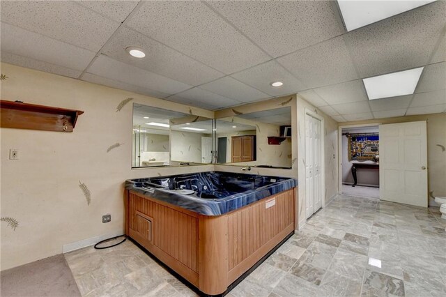 kitchen featuring a paneled ceiling