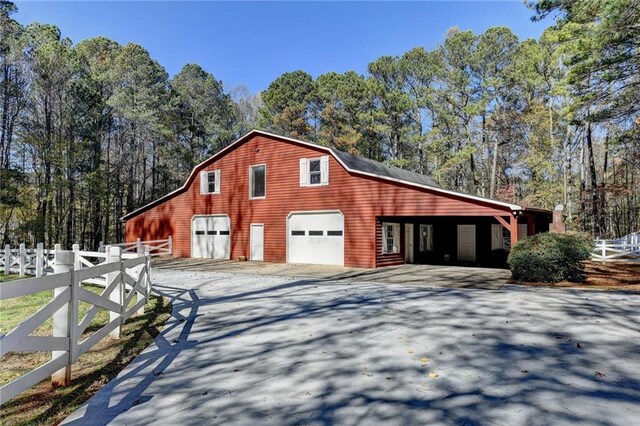 view of side of home featuring a garage