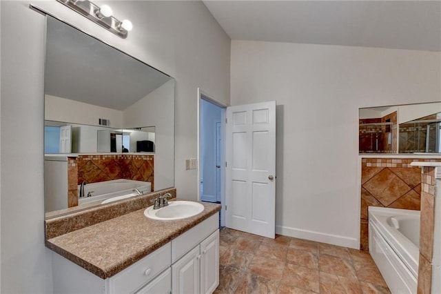 bathroom with a bath and vanity