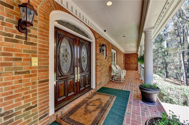 doorway to property with a porch