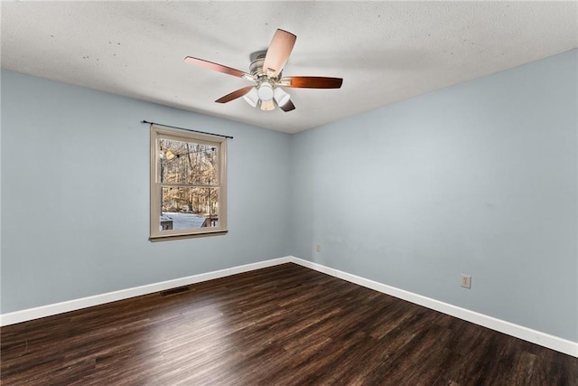 spare room with ceiling fan and hardwood / wood-style floors