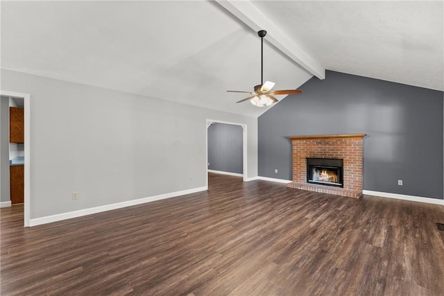 unfurnished living room with a fireplace, ceiling fan, dark hardwood / wood-style flooring, and vaulted ceiling with beams