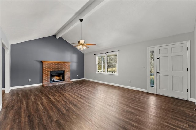 unfurnished living room with a brick fireplace, dark wood-type flooring, ceiling fan, and vaulted ceiling with beams