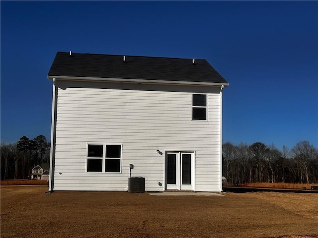 rear view of house with central AC