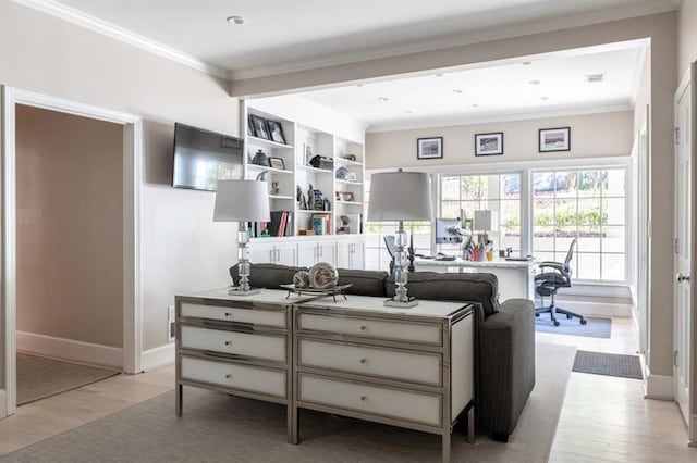 living area featuring light wood-type flooring, baseboards, and ornamental molding