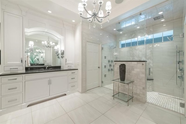 full bath with vanity, visible vents, a stall shower, tile patterned floors, and a chandelier