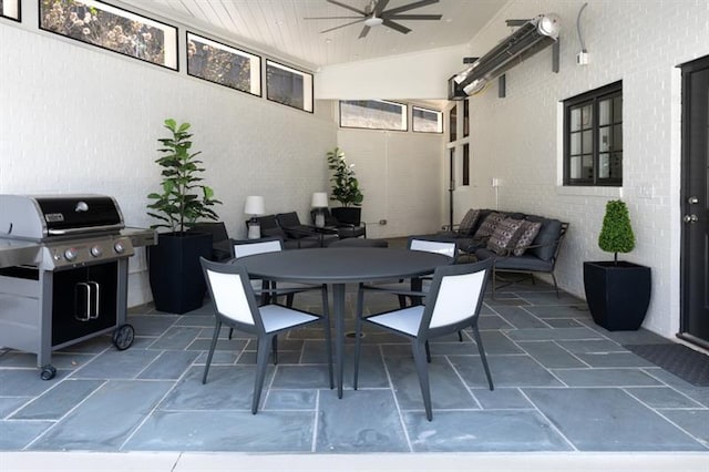 view of patio / terrace featuring outdoor dining area, grilling area, and a ceiling fan