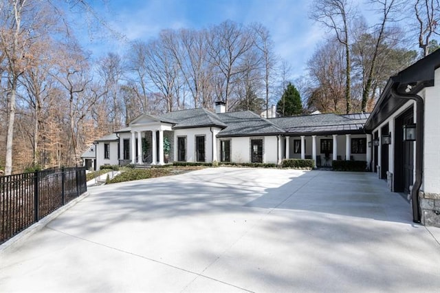 view of front of home featuring fence