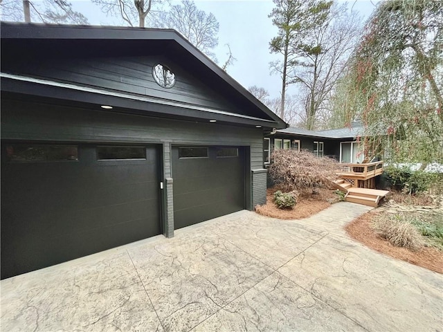 view of side of property featuring a garage