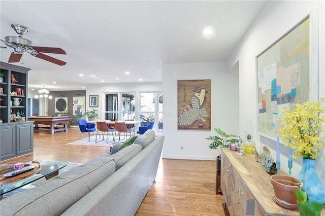 living room featuring ceiling fan, billiards, and light hardwood / wood-style floors