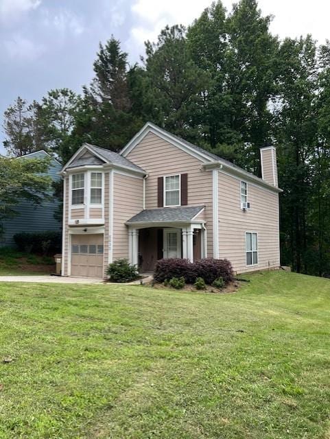 5030 N Bridges Dr, Alpharetta, GA 30022 - traditional-style home with an attached garage, a chimney, a front yard, and driveway