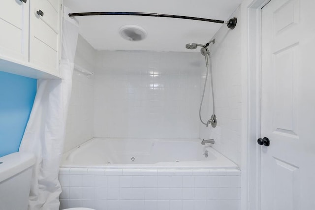 bathroom with toilet and shower / tub combo