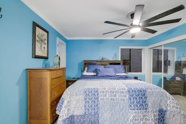 bedroom featuring ceiling fan and ornamental molding