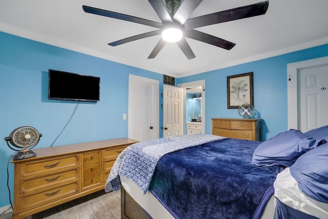 bedroom featuring crown molding, ceiling fan, and light hardwood / wood-style flooring