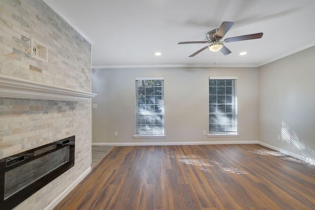 unfurnished living room featuring ceiling fan, dark wood-type flooring, and crown molding