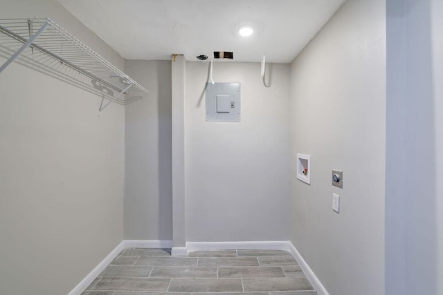 washroom with electric panel, hookup for a washing machine, and hookup for an electric dryer