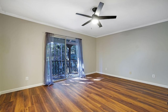 spare room featuring dark hardwood / wood-style flooring, ceiling fan, and ornamental molding