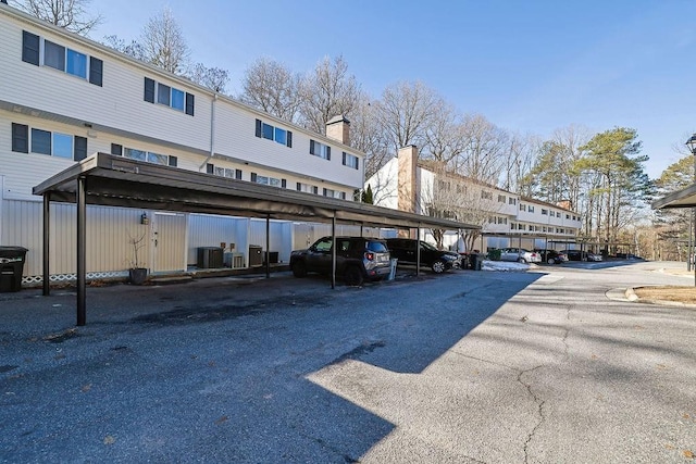 view of parking / parking lot featuring a carport