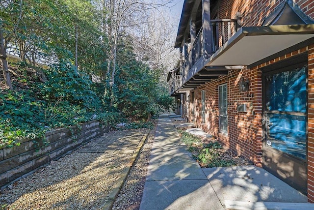 view of yard with a balcony and a patio area