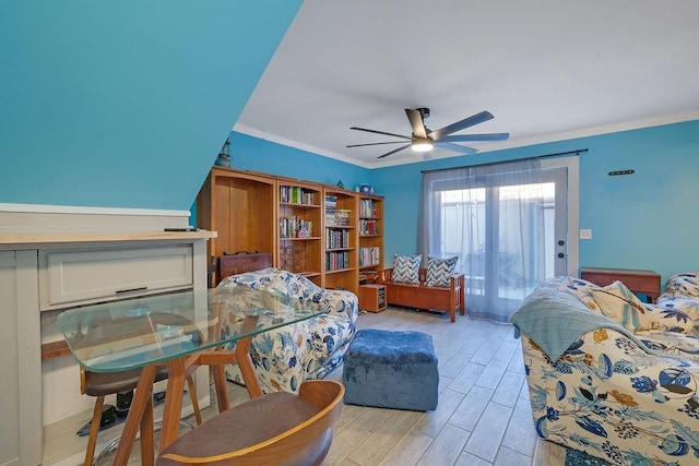 interior space with ceiling fan and crown molding