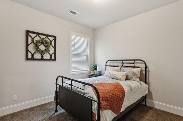 6977 Demeter Dr, Atlanta, GA 30349 - carpeted bedroom with baseboards